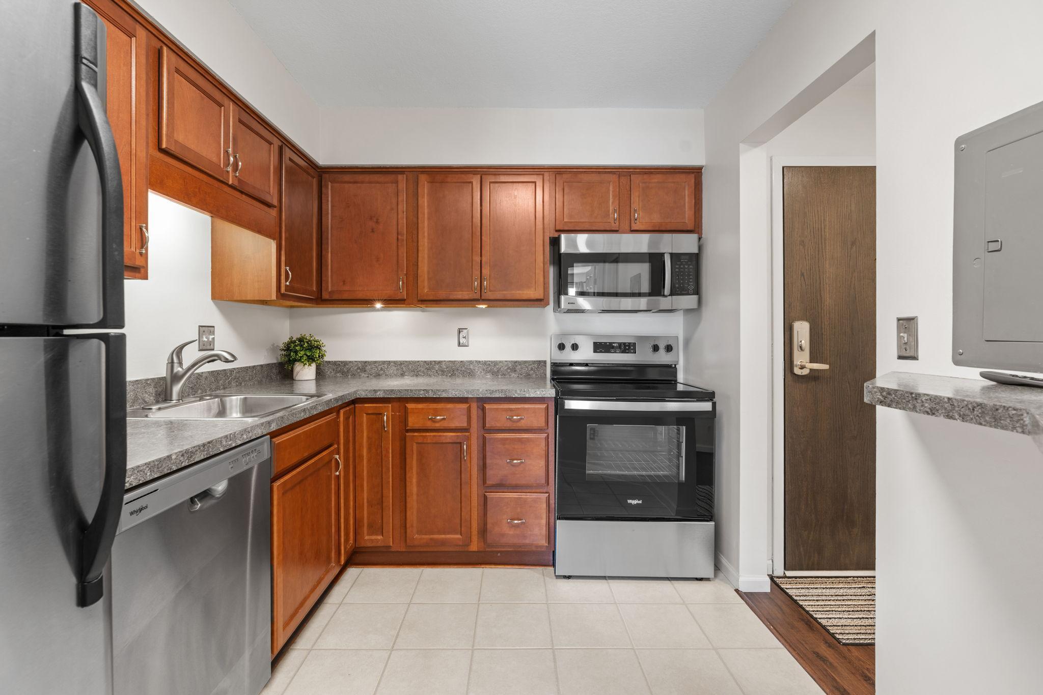 Kitchen - Tile Floors, Wood Cabinets, Under Cabinet Lighting