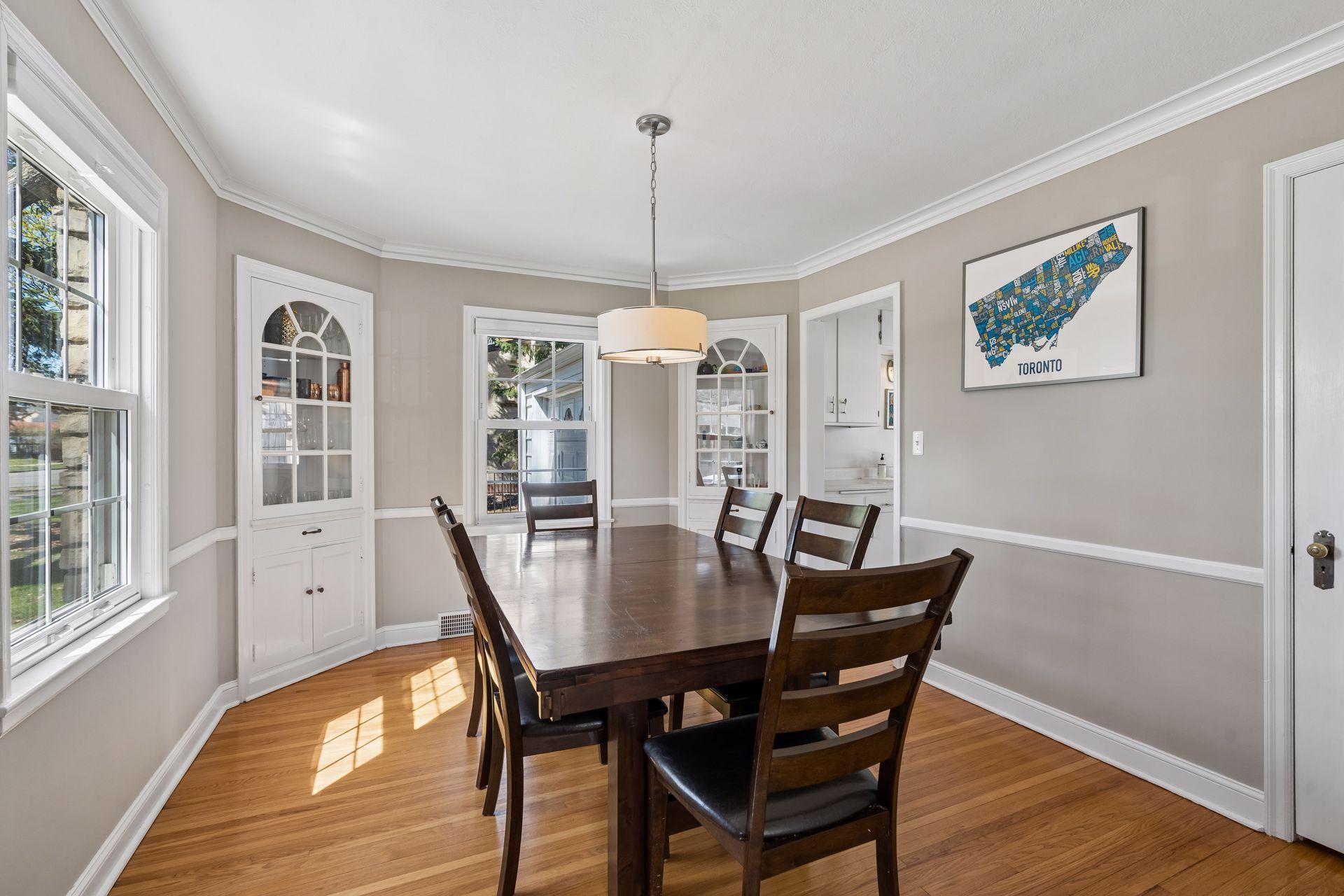 Formal dining room with corner built-ins and both crown and chair molding