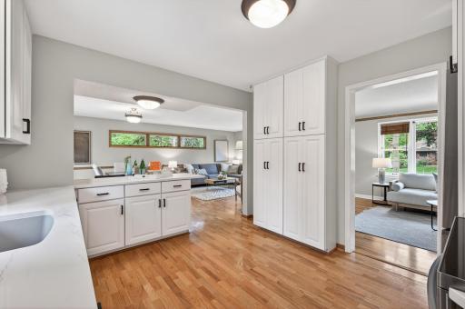 Open sightlines connecting the kitchen, dining, and living spaces