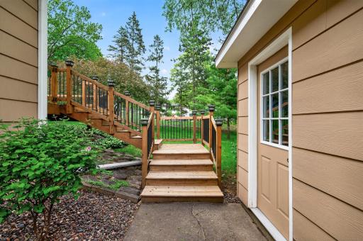 Convenient access between the deck, garage, and backyard spaces