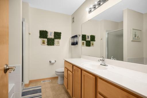 The upper level has two bedrooms and a full bath with a large vanity, relaxing soaking tub and separate shower.