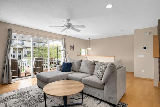 Enjoy the natural light from the large living room windows and door leading out onto the private deck.
