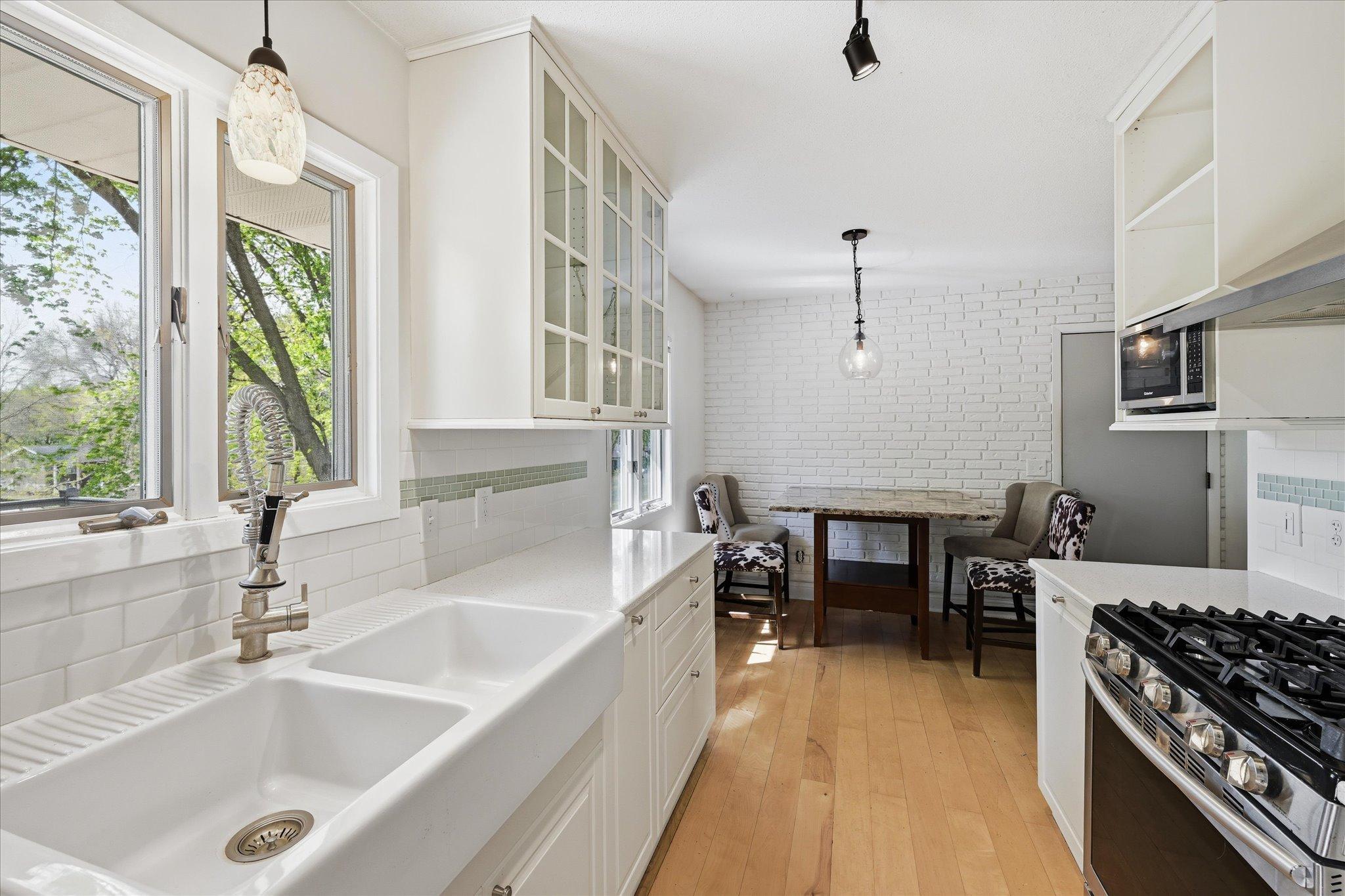 Farmhouse sink and thoughtful finishes add charm and function