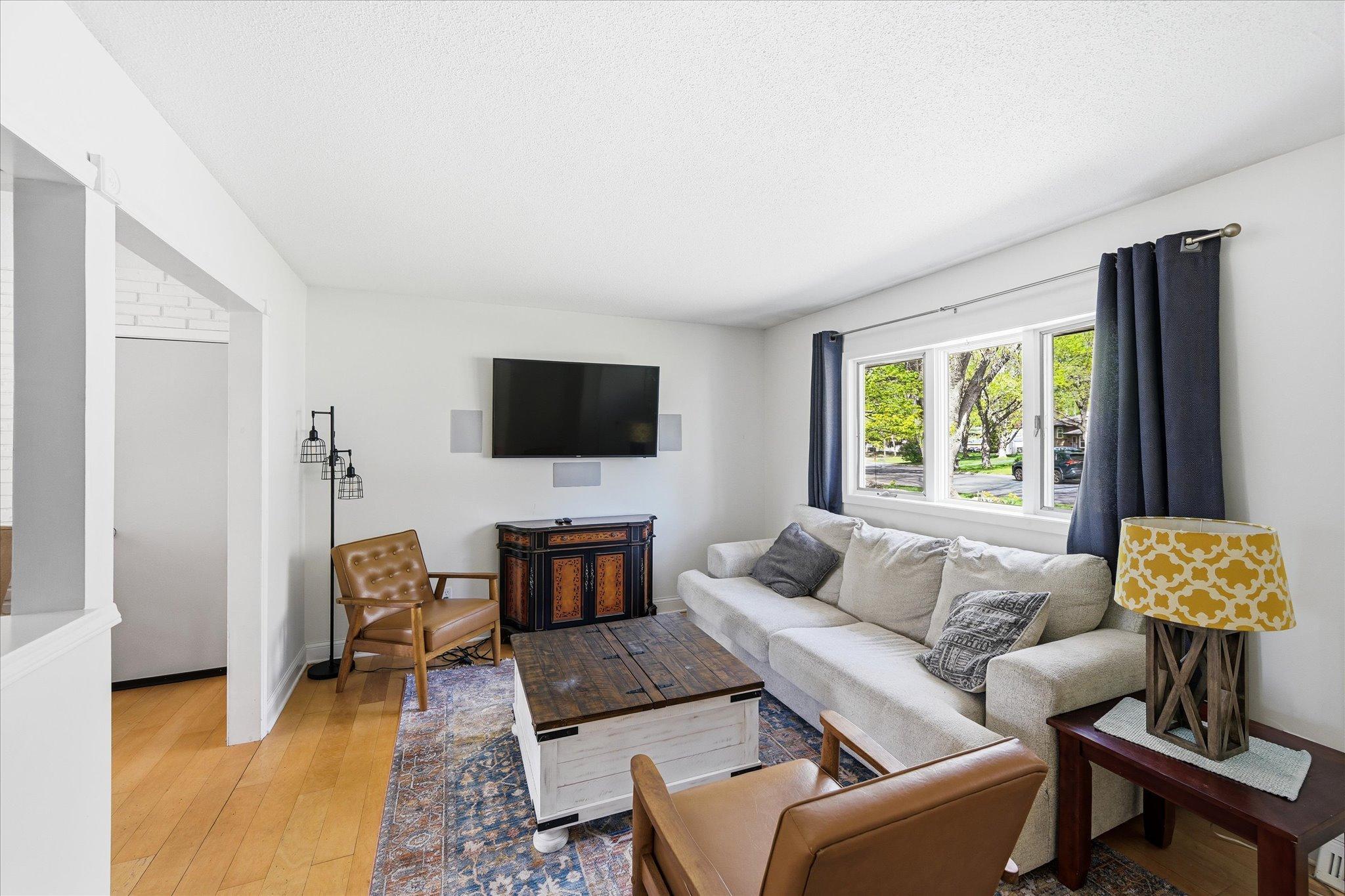Bright living room with large picture window and abundant natural light