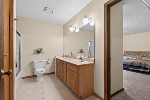 Spacious walk-through bathroom on main level.