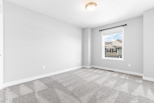 A view of the third bedroom on the upper level.