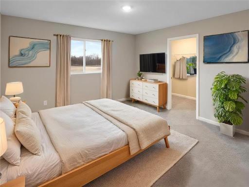 Primary Bedroom, Virtually Staged. Photo taken of another home with similar plan and finishes. Photos and renderings may not depict actual plan, materials, & finishes may vary. All measurements are approximate.