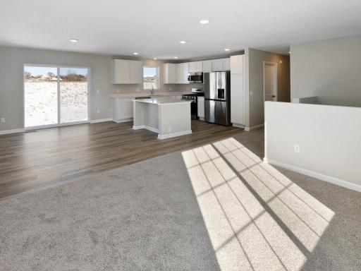 Open Layout. Photo taken of another home with similar plan and finishes. Photos and renderings may not depict actual plan, materials, & finishes may vary. All measurements are approximate.