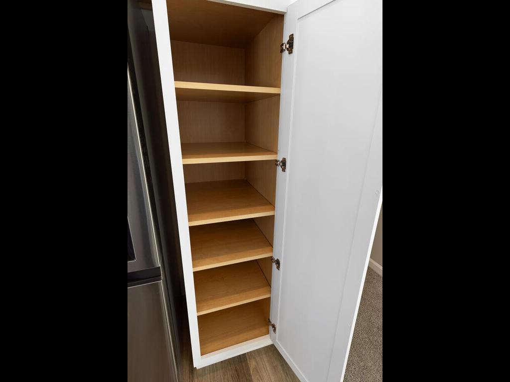 Kitchen, Pantry Cabinet. Photo taken of another home with similar plan and finishes. Photos and renderings may not depict actual plan, materials, & finishes may vary. All measurements are approximate.