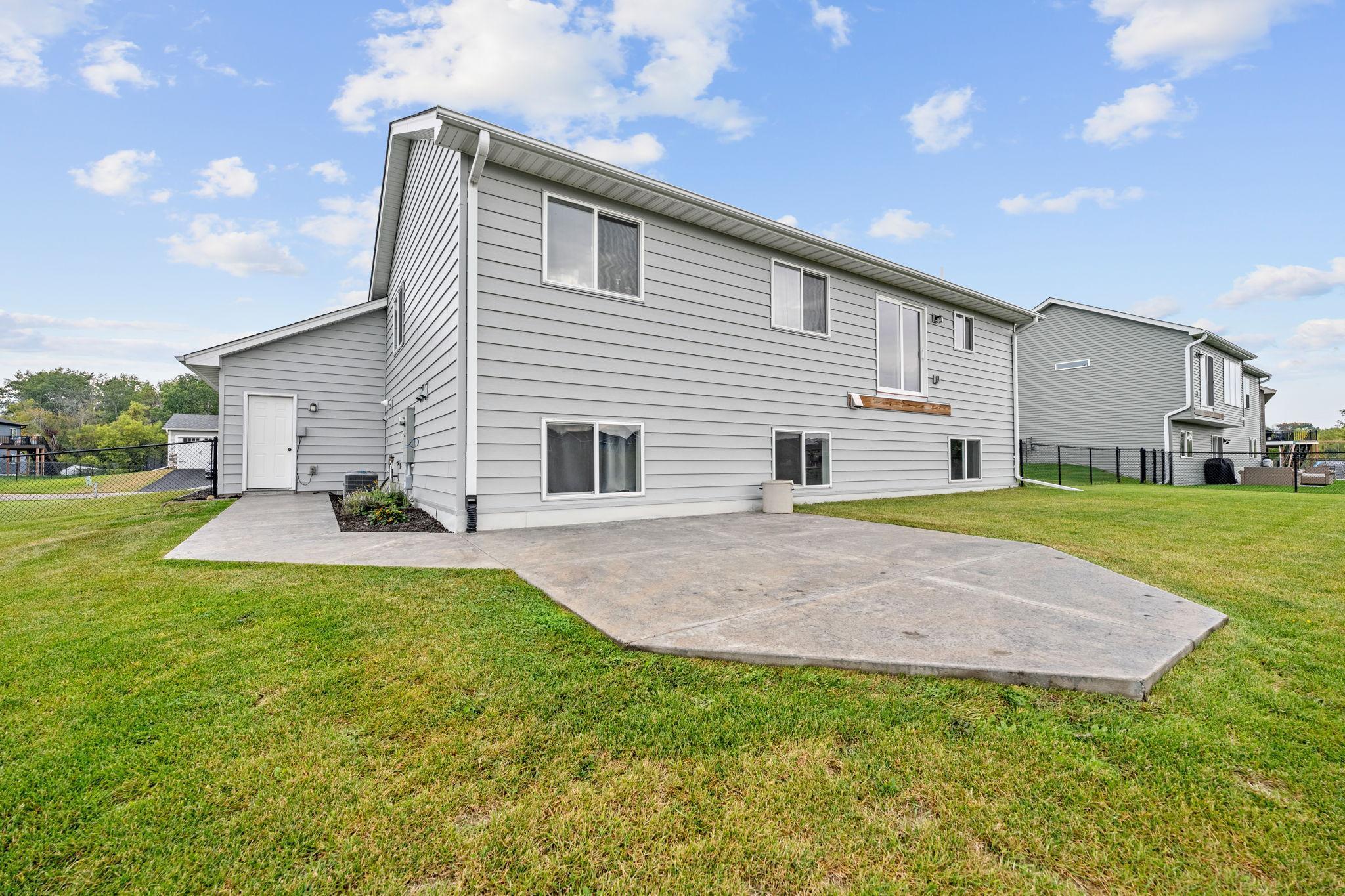 Backyard patio area over looking the water - perfect for summer nights!