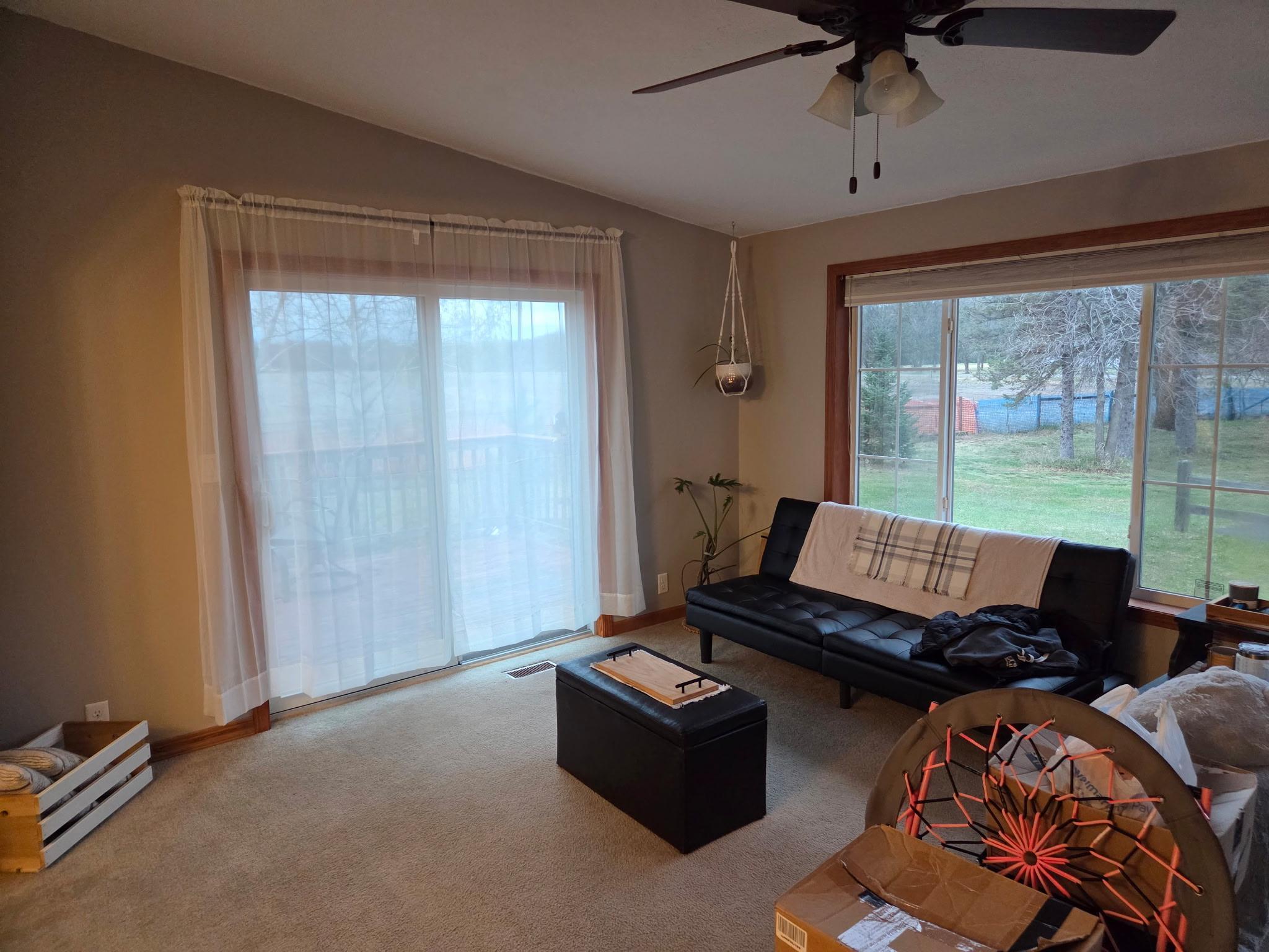 Living room with patio door to deck