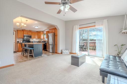 Open floor plan living room patio door leads to the deck