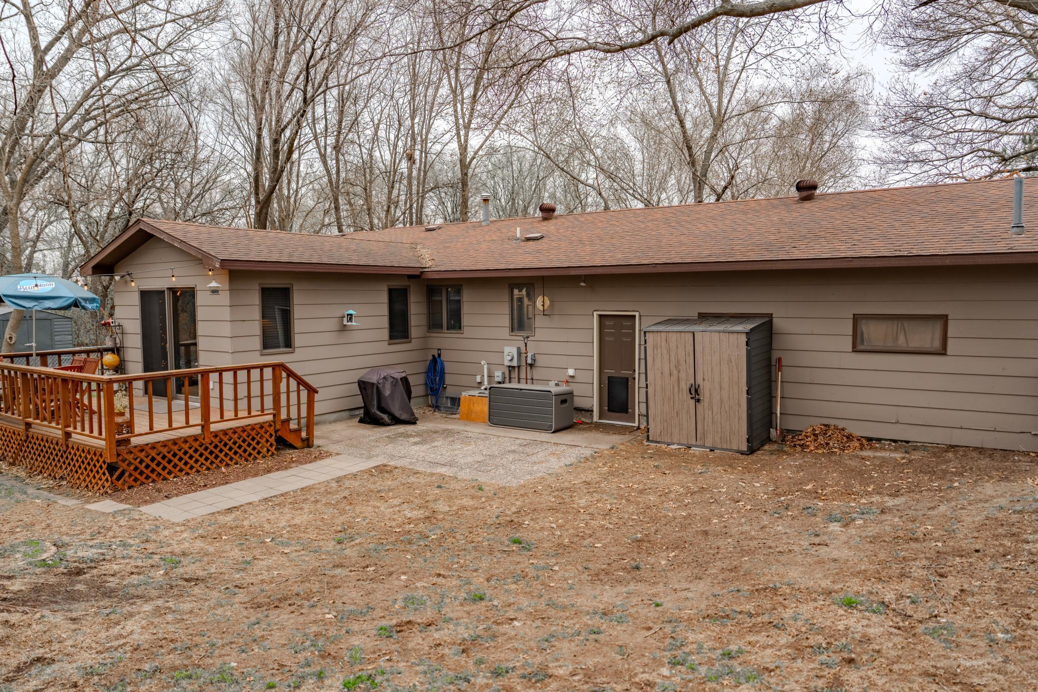 Small storage shed and dog door