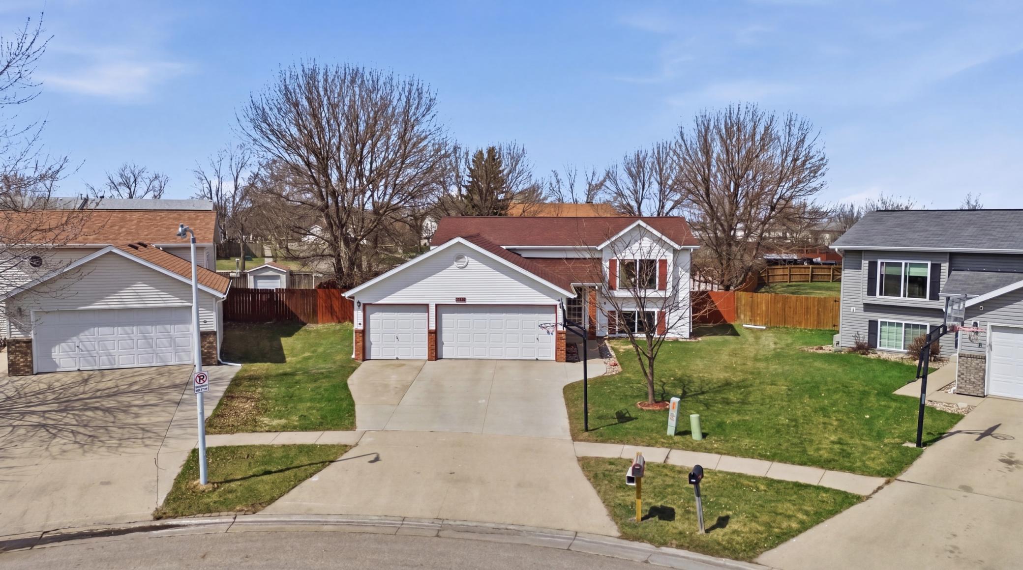 Large driveway with basketball hoop