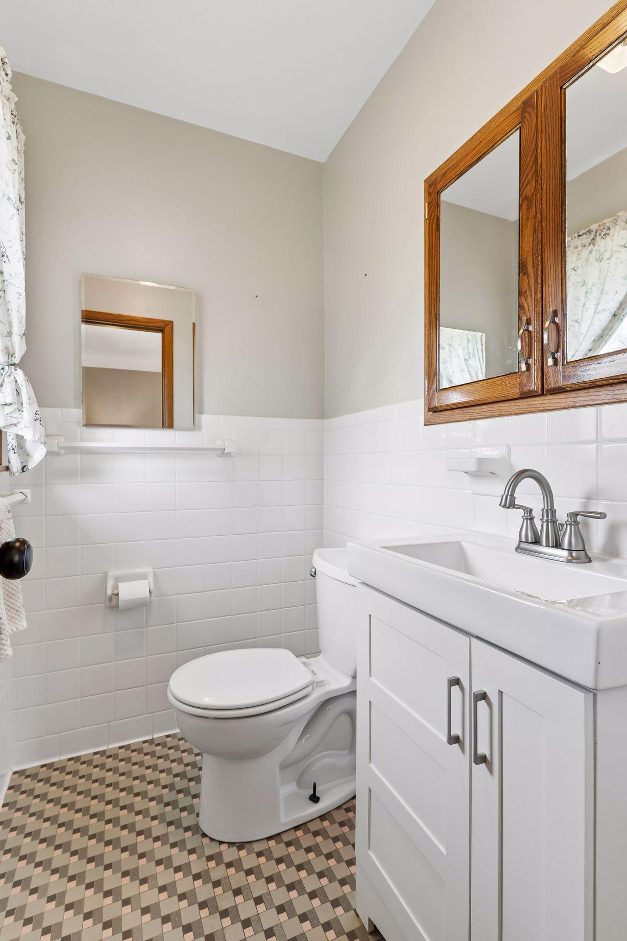 Main floor Bedroom #1 attached Half Bathroom.