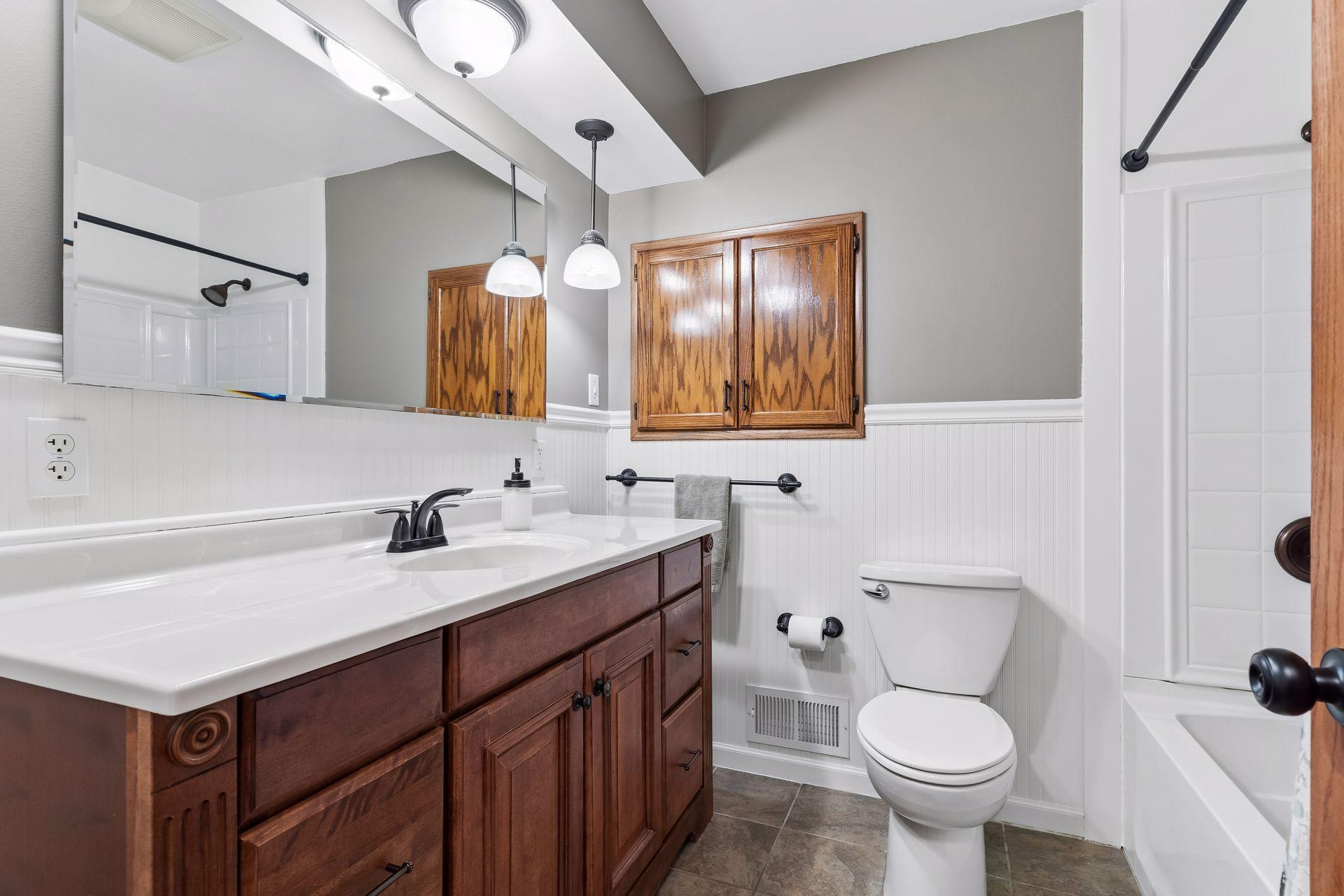 Main Floor Full bathroom with fresh paint and updated Lighting.