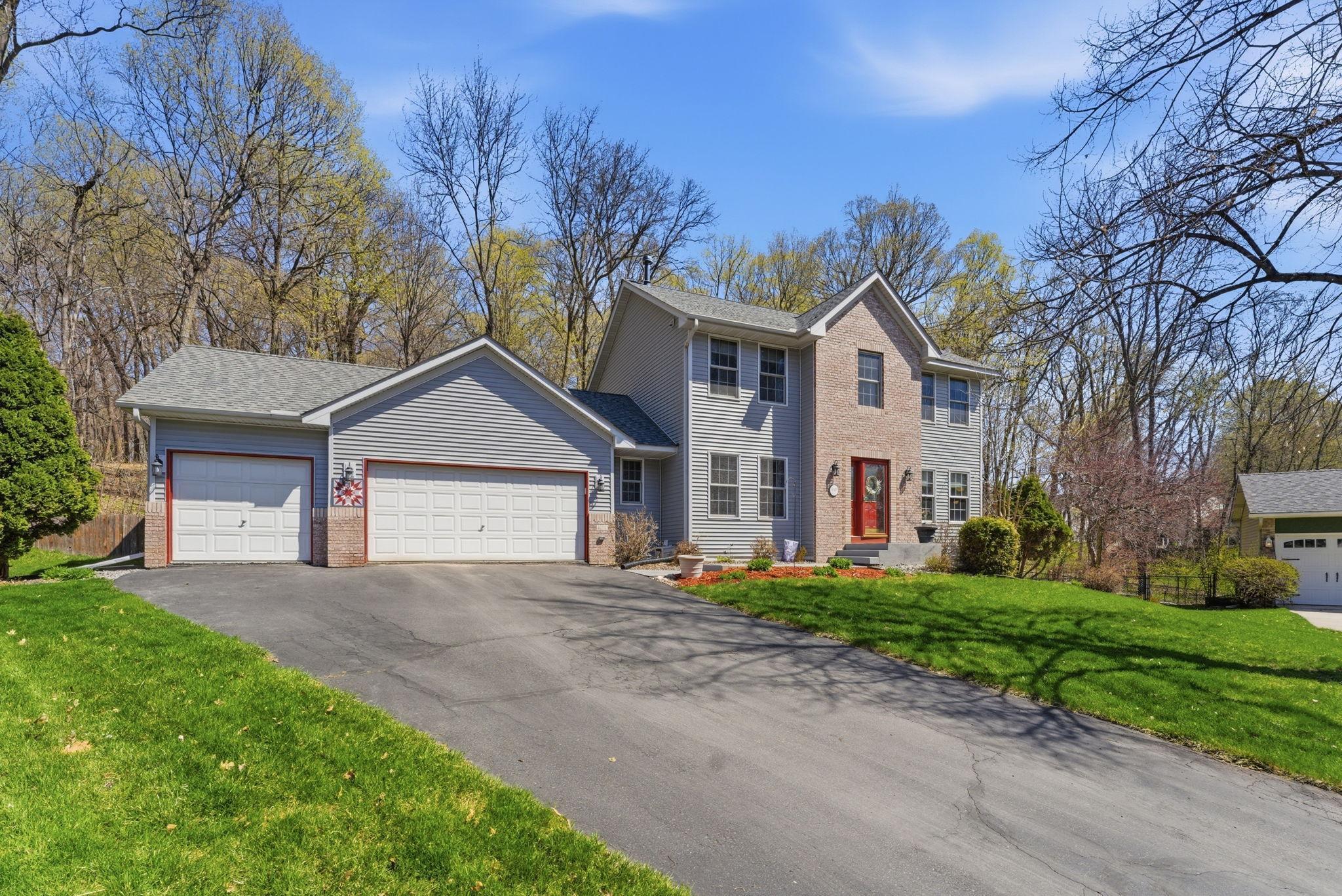 Stately 2 story home on the end of the cul-de-sac. Mature trees and private wooded backyard