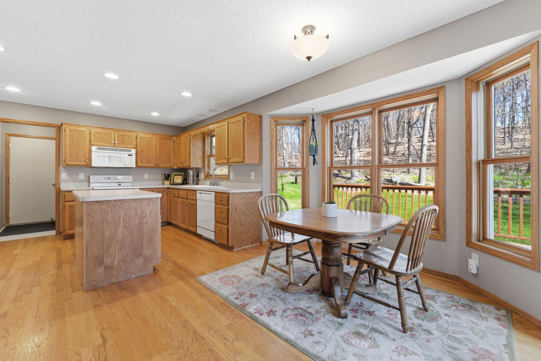 Wonderful informal dining area and kitchen with tons of windows that allow you to enjoy these amazing views of your backyard.