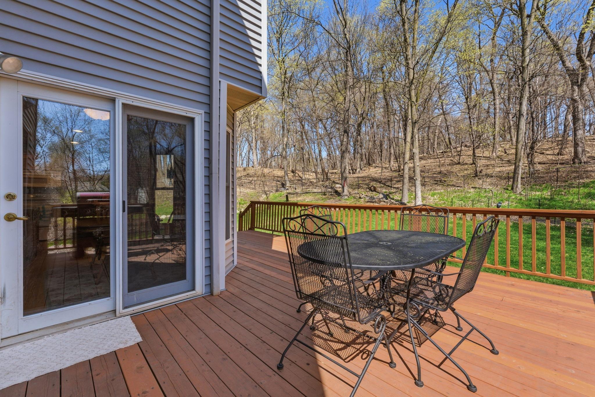 Enjoy relaxing on your deck and watching the birds and other wildlife in this private backyard.