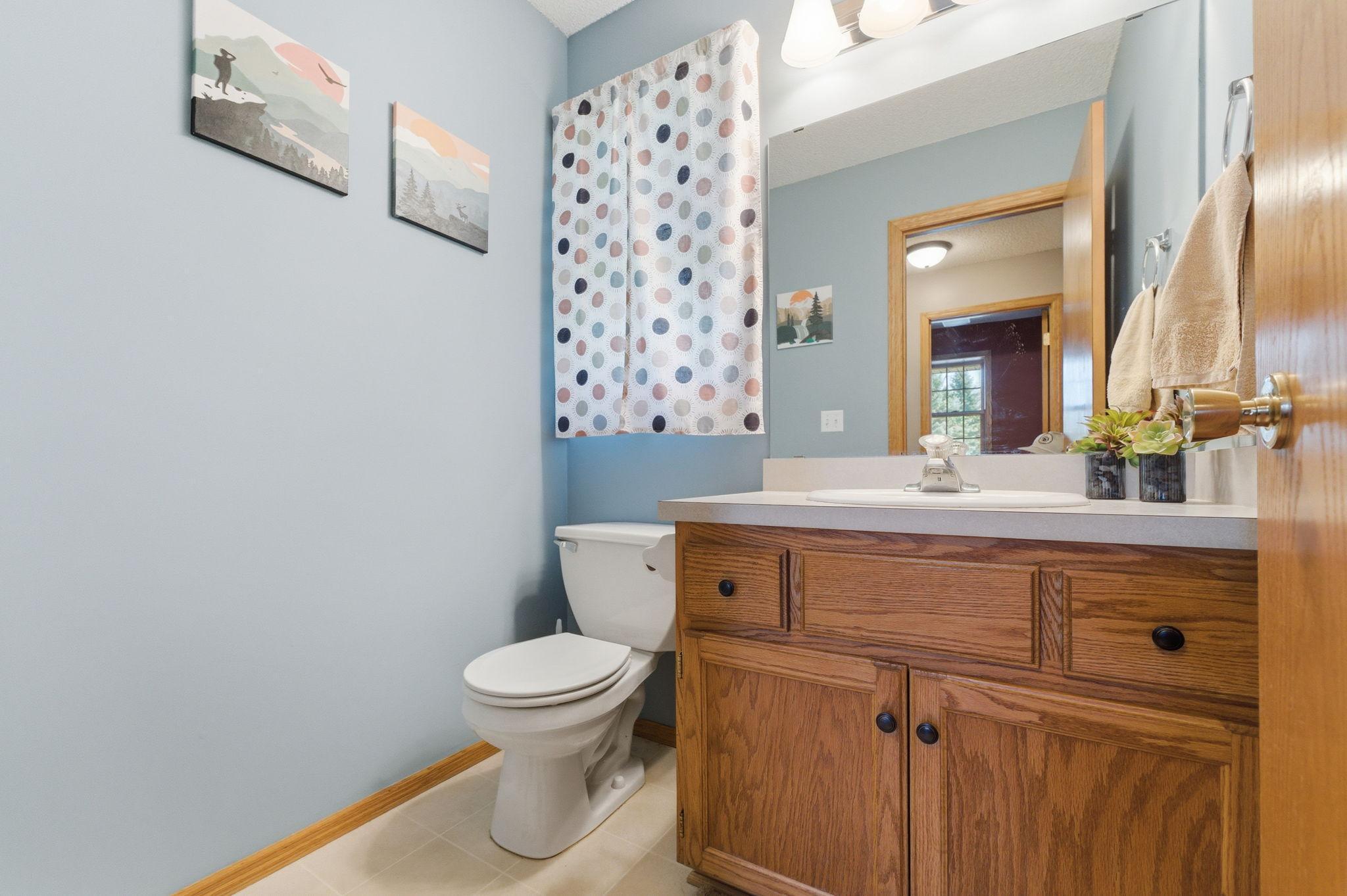 Main level 1/2 bathroom conveniently located off entrance from garage