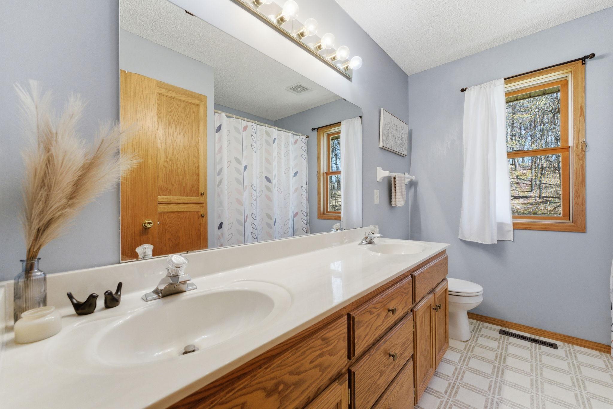 Upper level bathroom with double vanity