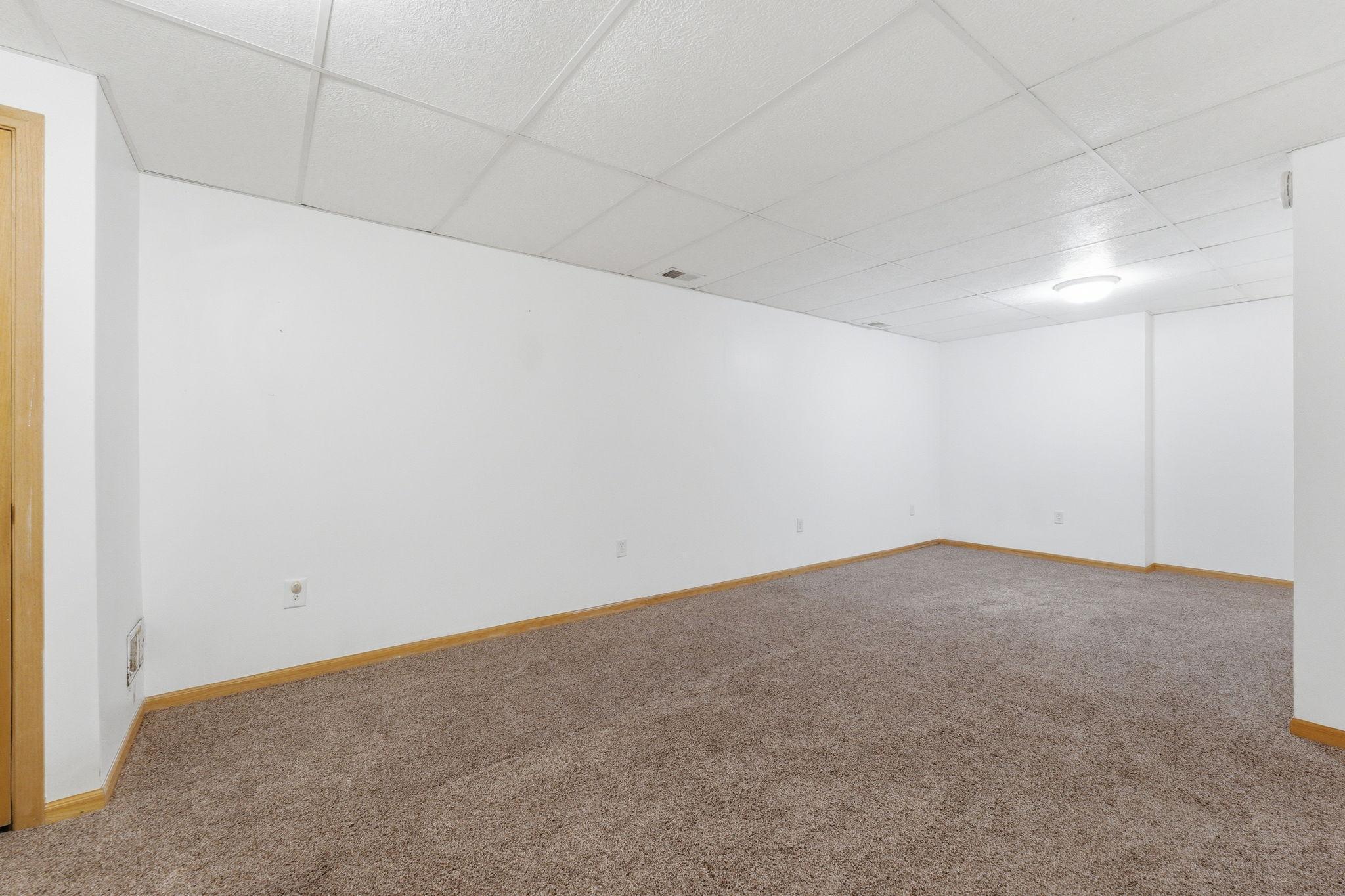 Family room space offers plenty of room for the big tv space, and room for a game table.