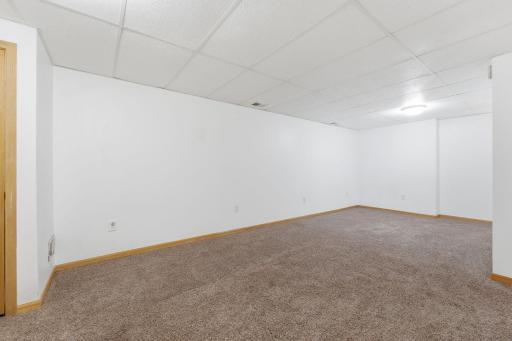 Family room space offers plenty of room for the big tv space, and room for a game table.