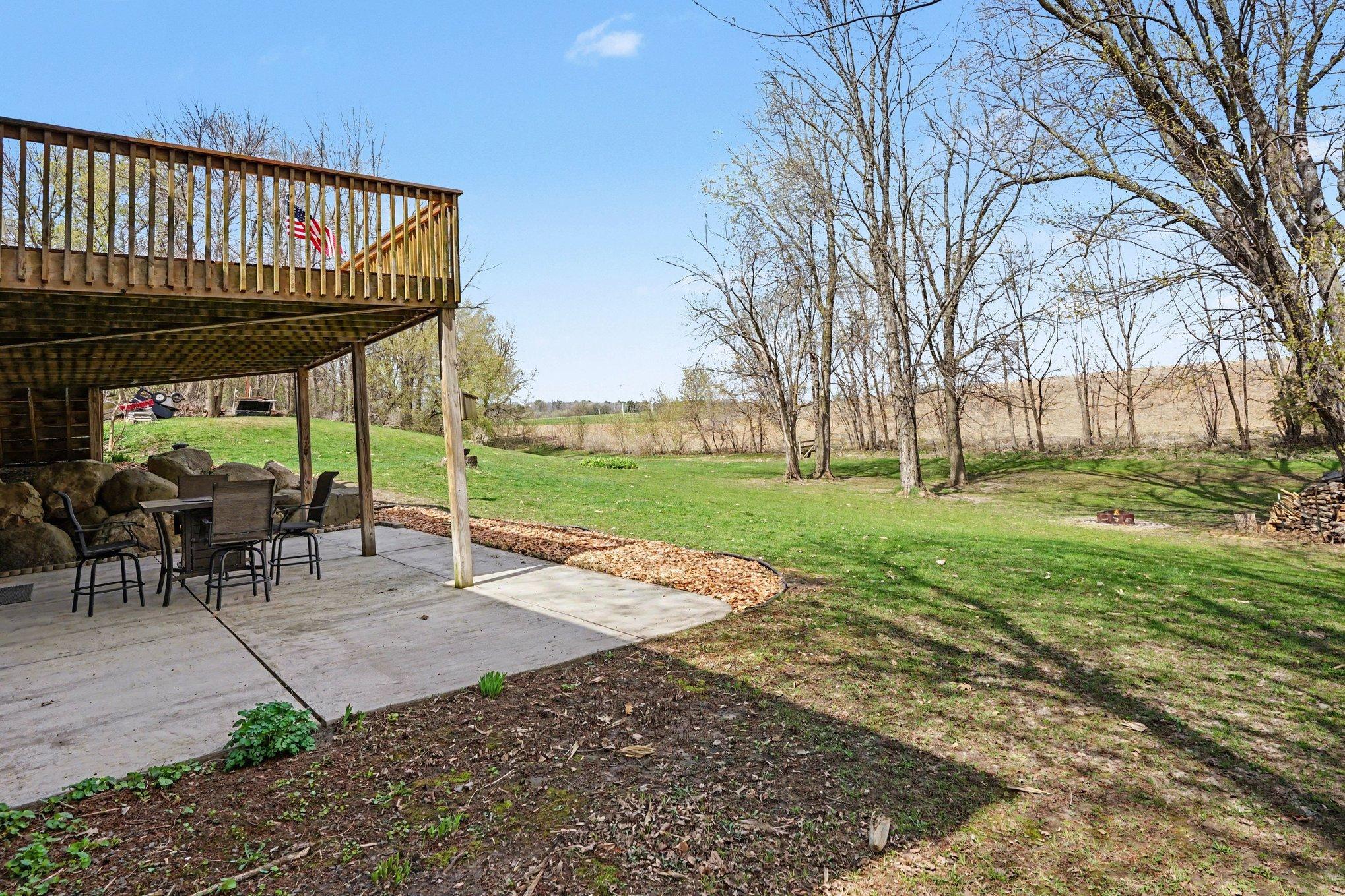 Spacious private backyard with walk down deck and ground floor patio.