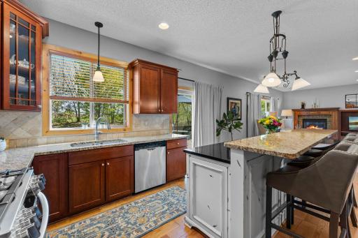 The kitchen provides direct access to the expansive deck, creating the perfect setting for indoor-outdoor entertaining.