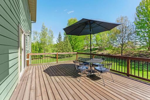 A look at the spacious deck, conveniently accessible from the kitchen, offering the perfect space to relax with a cup of coffee, enjoy the outdoors, or entertain family and friends.