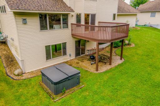 The expansive deck and walkout lower level create the perfect setting for grilling, gathering, and enjoying the outdoors.