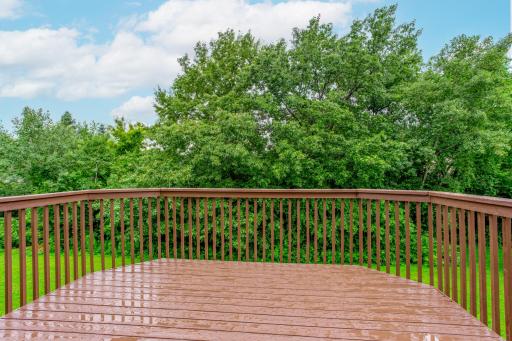 Step outside to a spacious deck overlooking a private, tree-lined backdropâideal for morning coffee or evening relaxation.