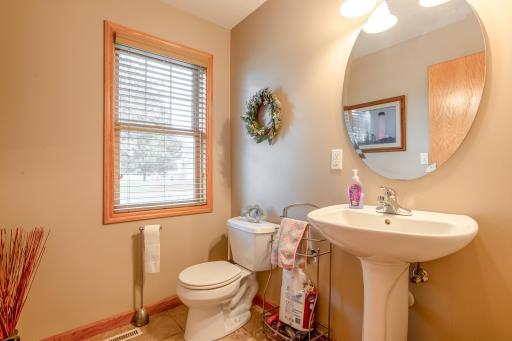Well-placed half bath offers comfort and convenience for guests and daily living.