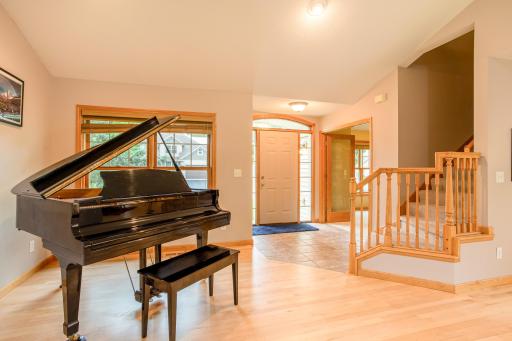 Thoughtfully designed main level with seamless flow from the foyer into the expansive living and dining areas.