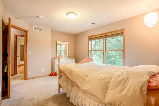Inviting bedroom offers room to unwind, complete with a walk-in closet and direct access to the walk thru bathroom.