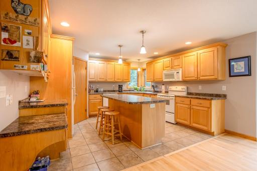 Bright and functional kitchen featuring abundant cabinetry, a large center island, and plenty of workspace for everyday living.