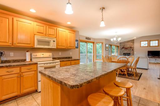 The kitchen flows seamlessly into the dining and living areas, creating an ideal space for entertaining and everyday life.