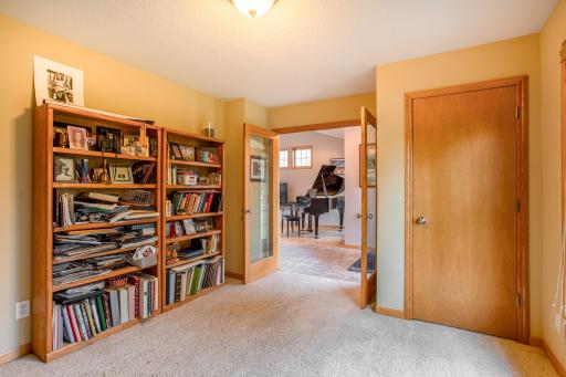 A flexible room near the entry can easily function as a bedroom, home office, den, or guest space.