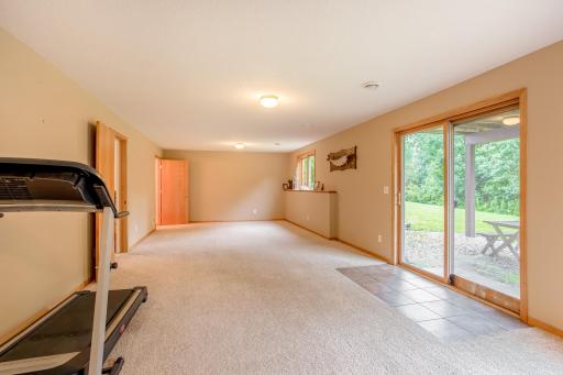 Sliding glass doors create seamless indoor-outdoor living with direct access to the patio and private yard.