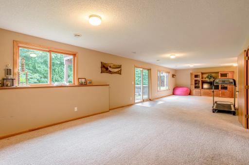Oversized windows and an open layout make this lower-level retreat feel bright and welcoming.
