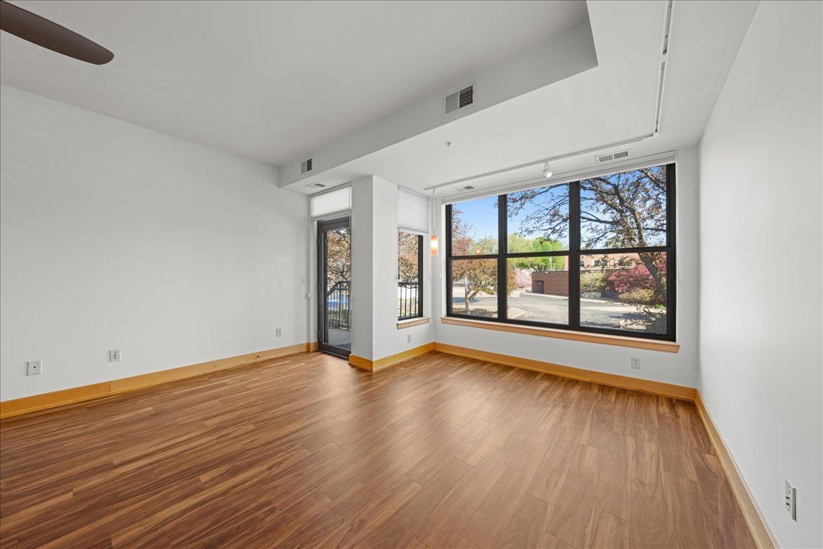 Living area w/custom window treatments