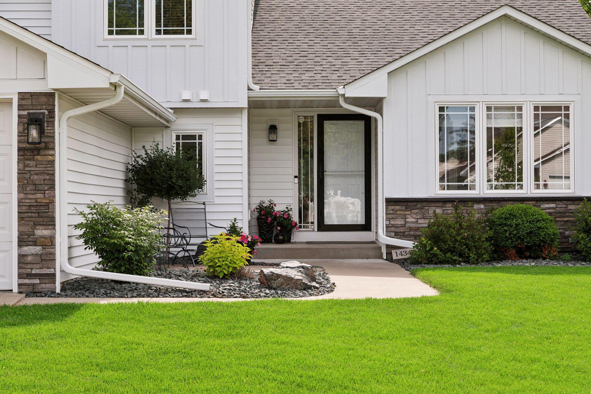 Loaded with upgrades in and out. The charming exterior has newer vinyl siding and Board and Batten details, new roof and new gutters (2023).