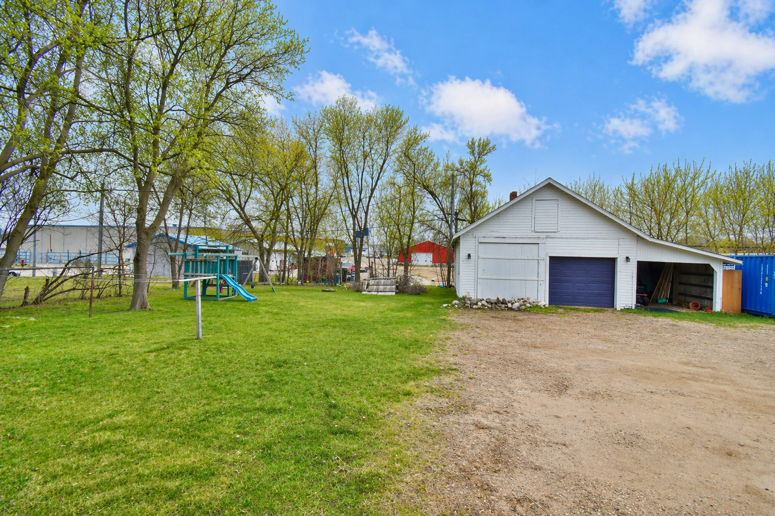 Oversized 2 car garage with a car port as well