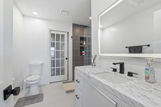 Beautiful custom primary bath with deep soaking tub, ceramic tile shower and check out the smart mirror!