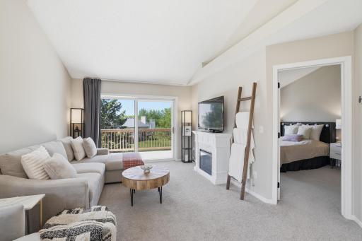Walkout the patio door to your private deck overlooking grassy green space!