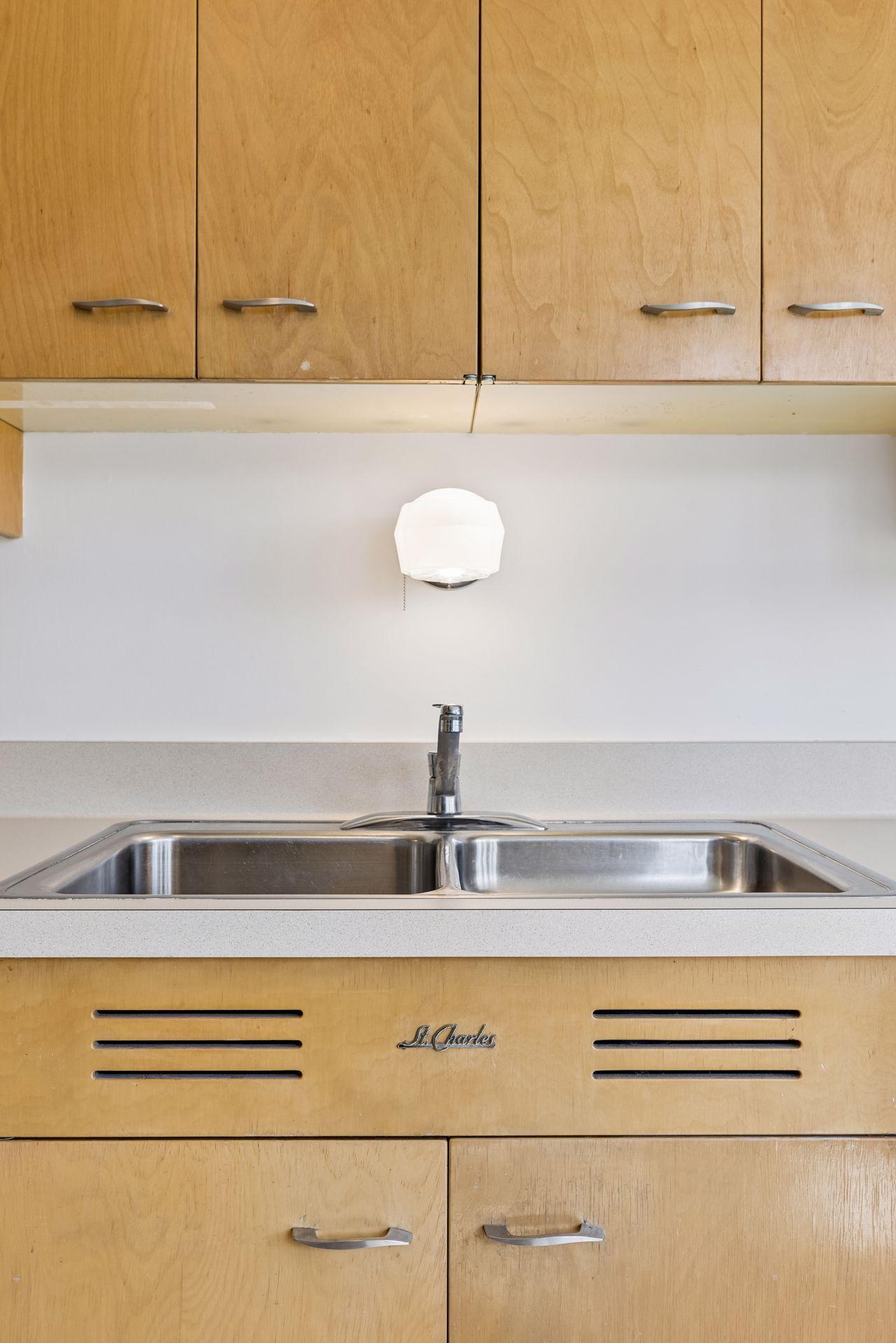 Mid-century enthusiasts will appreciate the classic St Charles cabinetry and all of the cutting edge extras of their day! Open up the cabinets to discover the many ahead-of-their-time features they offer.