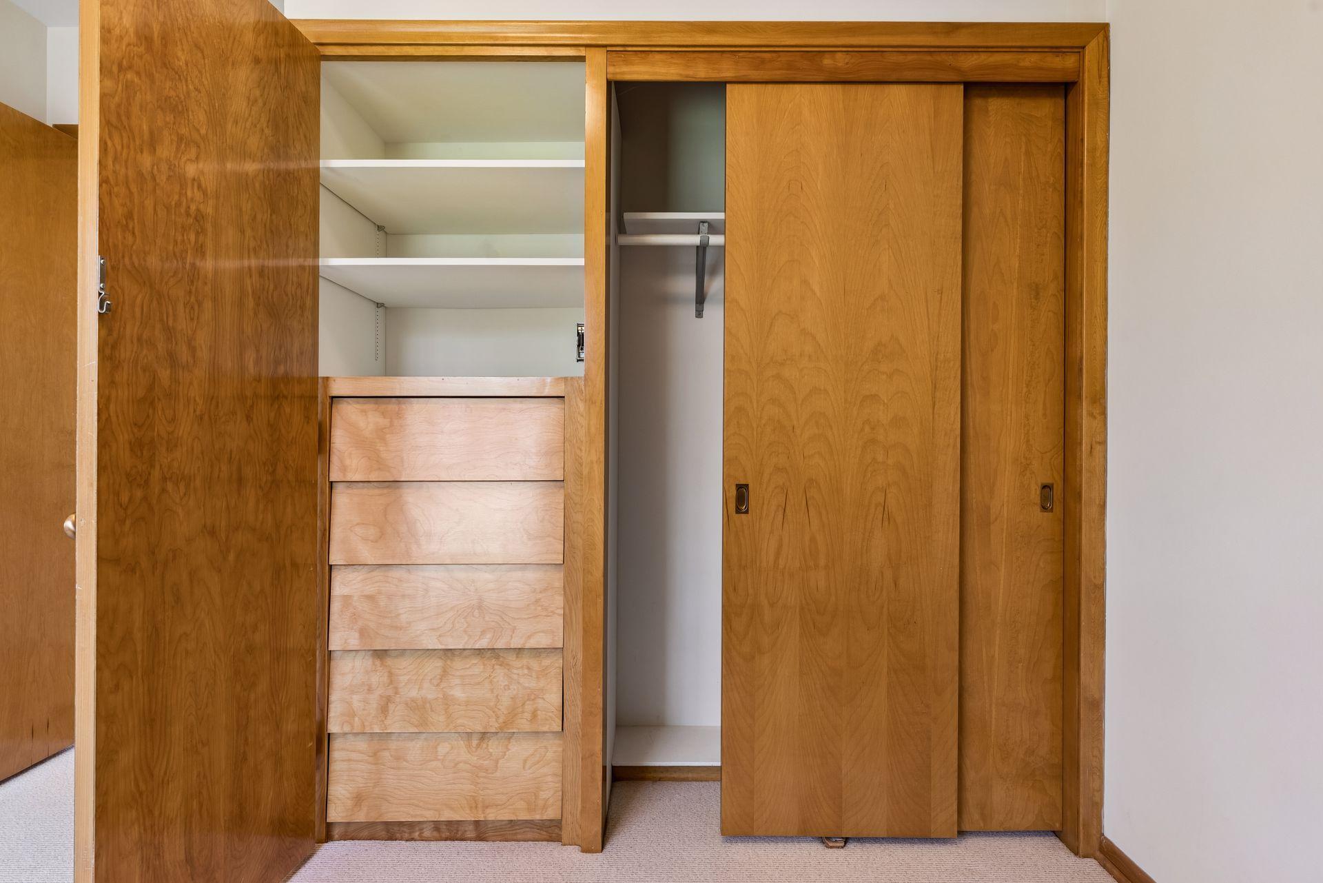 Both secondary bedrooms have custom storage areas with built-in dresser drawers and shelving in addition to hanging closet space.