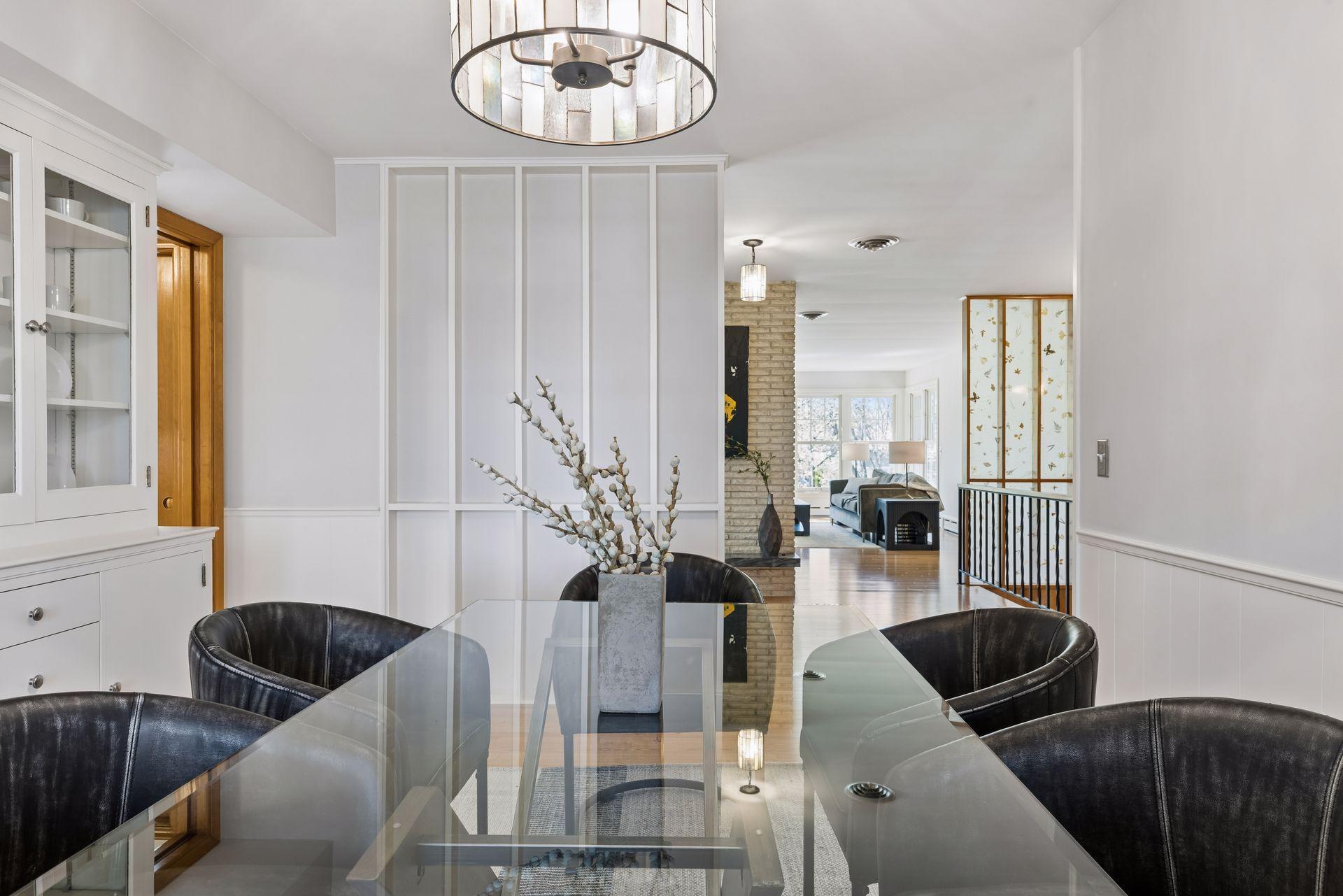 The formal dining room is spacious and bright with hardwood floors and enough room for all. your guests.