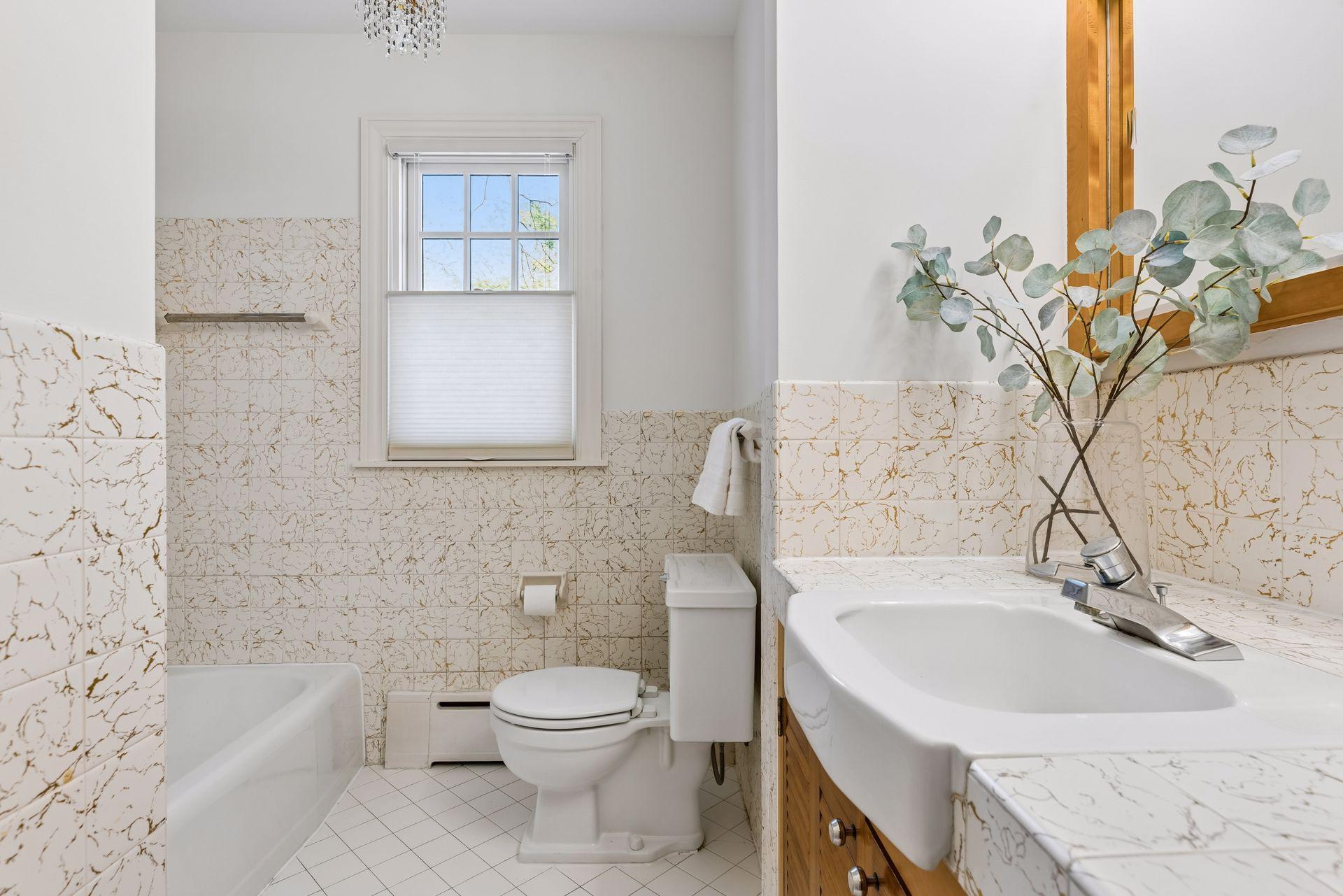The main floor full bath is a delightful reminder of the quality and style of it's era.