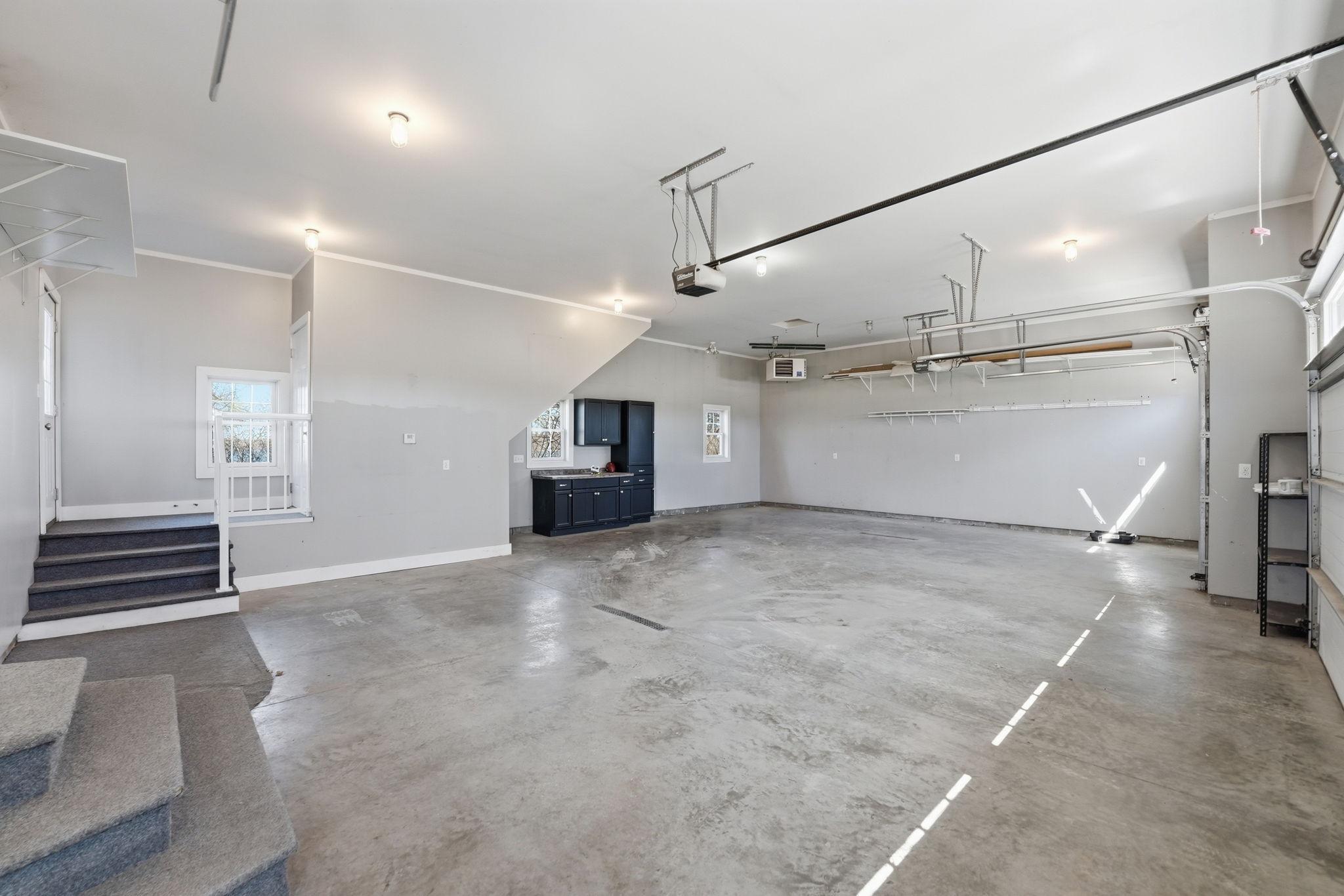Attached finished garage with bunk room above. Gas heater as well.